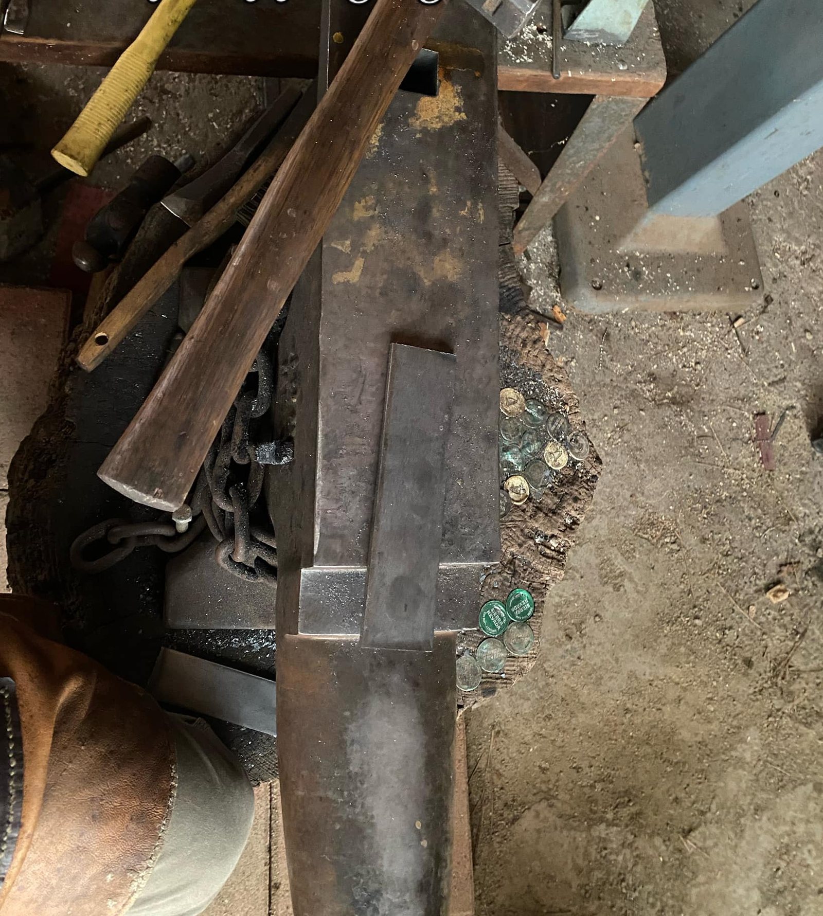 Hammers and tongs beside the anvil at the end of a long day at the forge